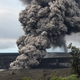 An ash column rises from the summit crater at Kilauea volcano following a small explosion on Wednesday.